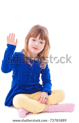 Little girl gesturing hello sitting