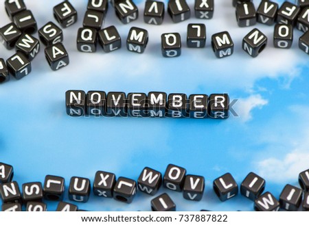 The word November on the sky background