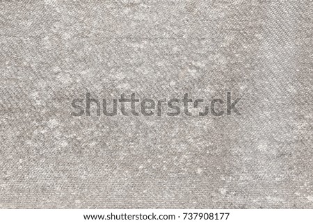 Shale sheet with scratches, traces of weather damages. Abstract gray background with a relief texture. Rough surface.