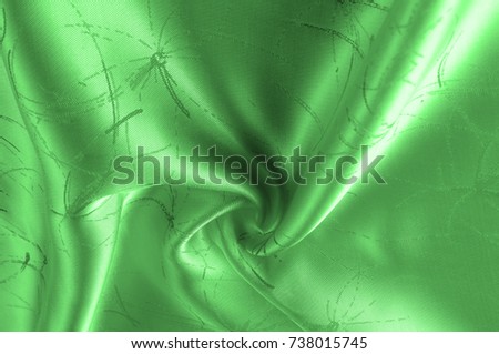Soft focus Background texture, pattern. Silk fabric is green with a pattern of lines. This green silk crepe de China is here to charge your fanasium! It is a subtle shine
