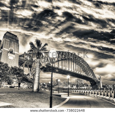 Beautiful view of Sydney Harbour Bridge with sunset sky, Australia.