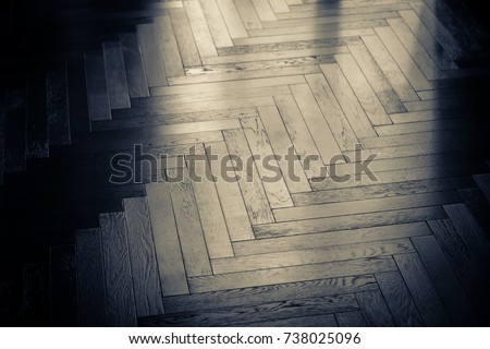 zigzag wood floor pattern background with light from window close up detail