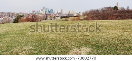 A very large panoramic view of all of the Kansas City skyline.