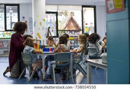 Group of diverse students at daycare Royalty-Free Stock Photo #738054550