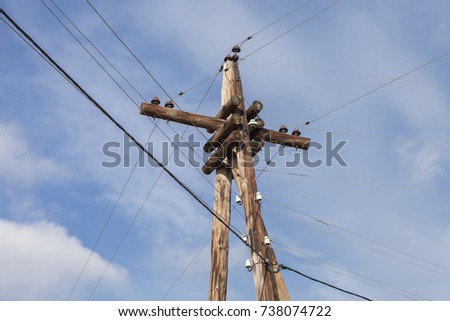 poles with wires on a background blue sky