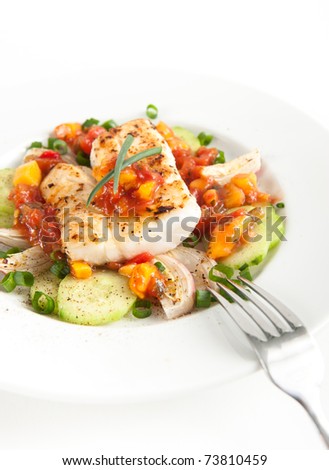 Closeup of Dinner Plate with Grilled White Fish and Vegetables