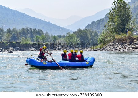 River rafting in Beas river at Kullu, Himachal Pradesh, India. Royalty-Free Stock Photo #738109300