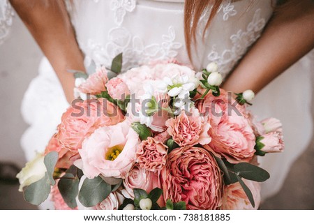 Bride holding a wedding bouquet in her hands