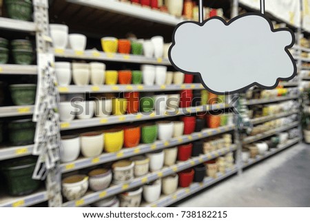 Store pottery in the supermarket, defocused image. Place for your text.