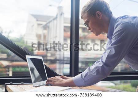 smart businessman work with laptop in office, business concept