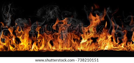 Texture of fire on a black background. Royalty-Free Stock Photo #738210151