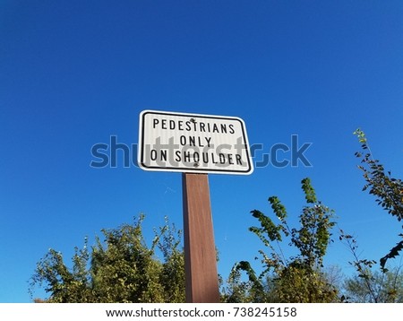 pedestrians only on shoulder sign