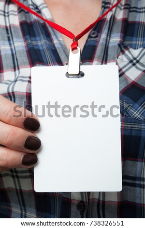 Identification of a blank white plastic card ID on the neck on the shirt in the square. Mockup for design.