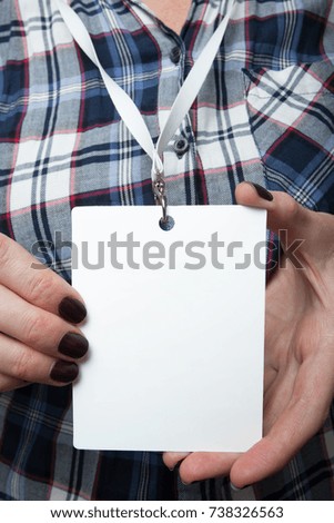 Close-up of an empty id card with a white rope on the female neck. Mockup.
