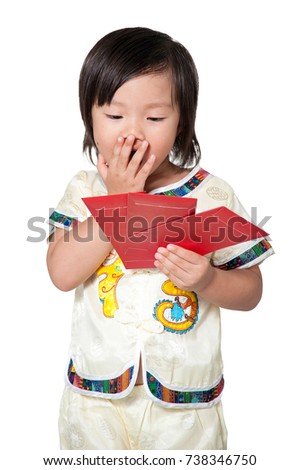 Happy Chinese new year. Cute Asian girl in cheongsam of traditional chinese dress in clipping path on isolated white background. Little kid chocking and holding red envelope of packet monetary gift.