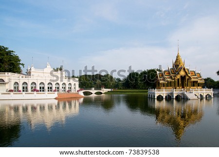 The Thewarat Khanlai gate and Phra Thinang Aisawan Thiphya-Art pavilion at the Royal Palace in Bang Pa In, Ayuttaya, Thailand. Royalty-Free Stock Photo #73839538