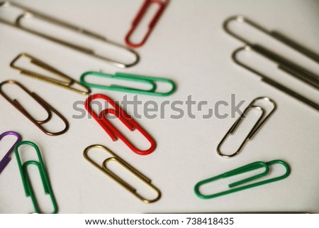 paperclips on the white paper background for text