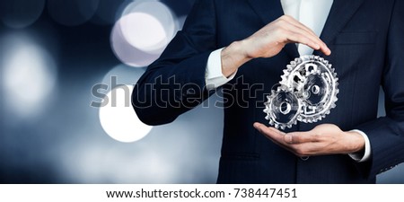 man hand  gears in screen on dark background