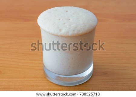 Yeast Sourdough Starter with sugar, flour and water in glass.