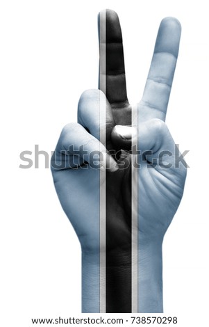 and making victory sign, Botswana painted with flag as symbol of victory, win, success - isolated on white background