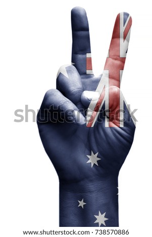 and making victory sign, Australia painted with flag as symbol of victory, win, success - isolated on white background