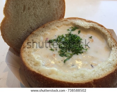 clam chowder in bread bowl Royalty-Free Stock Photo #738588502