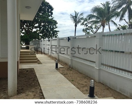 new white house fence from perspective view Royalty-Free Stock Photo #738608236