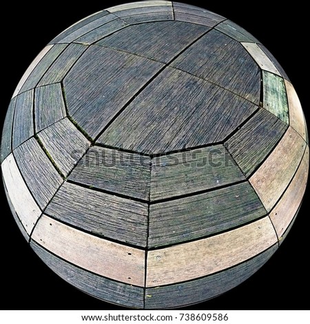 A bulging view of a twelve-sided polygon timber decking through fisheye in dark background. 