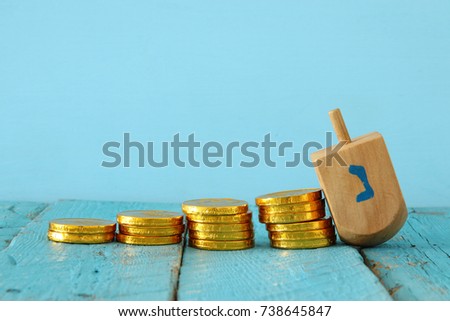 jewish holiday Hanukkah image background with traditional spinnig top and chocolate coins.