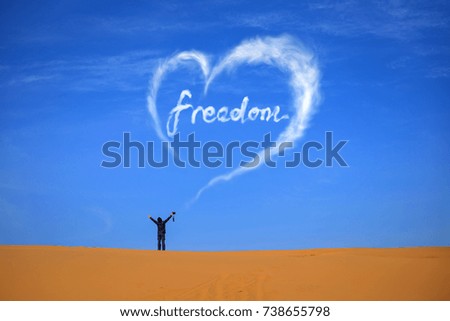 The "freedom" font of the cloud formed over the desert, the conceptual background.