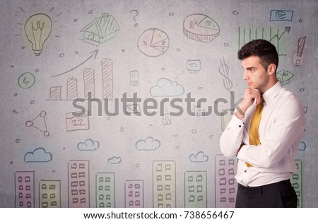 A young adult businessman standing in front of a wall with colorful drawings of buildings, charts, graphs, signs concept