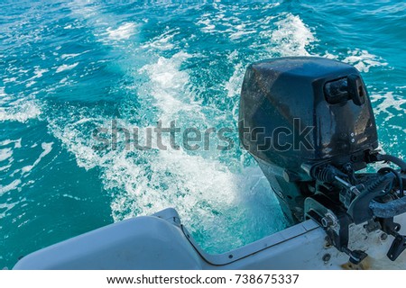Trail on water behind motor boat. Royalty-Free Stock Photo #738675337