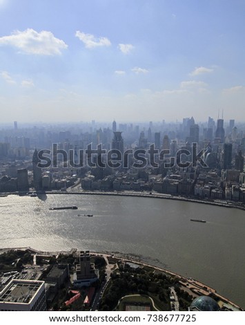 View over the skyline of Shanghai, China on a sunny day with some pollution