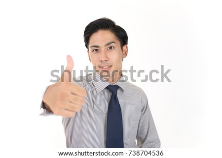 Asian business man showing thumbs up sign