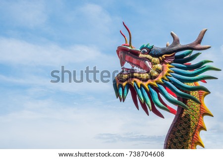 Head Dragon statue in Public Chinese shrine on sky background