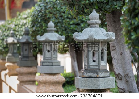 Selective focus Stone lantern-shaped Chinese pavilion decorated in a shrine.