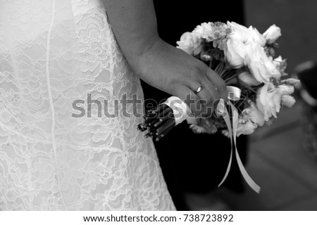 Black and white bride holding a flowers