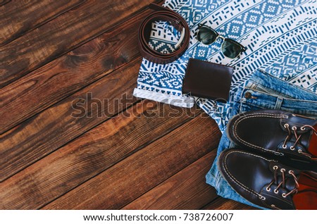 Summer man outfit on wooden rustic floor
