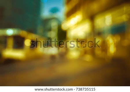 BLURRED CITY STREET IN THE EVENING