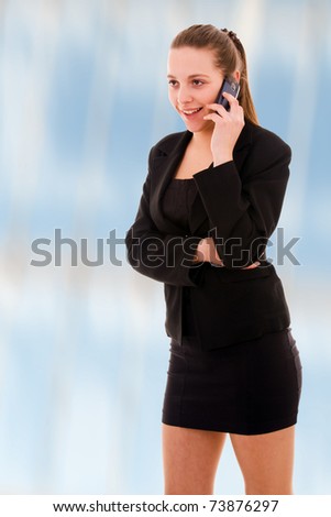 beautiful young business woman on the phone at modern office