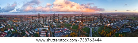 Aerial view of the city at sunset. Beautiful autumn city landscape. Panorama.
