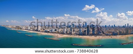 Tel Aviv skyline off the shore of the Mediterranean sea - Panoramic aerial image Royalty-Free Stock Photo #738840628