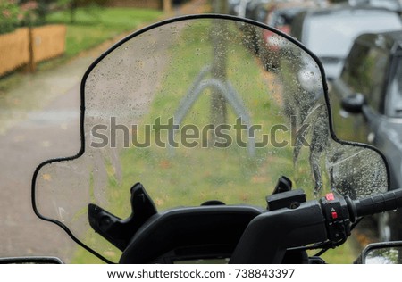 Wet windshield of a scooter