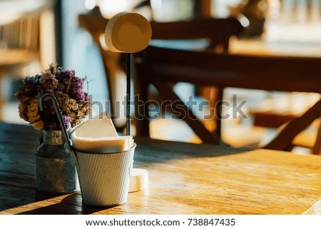 Flowers at table in cafe.
