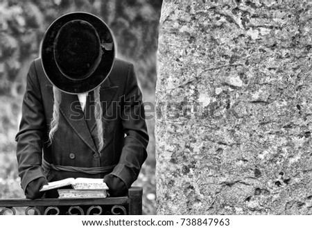 Orthodox Jewish pilgrims prays, jews,  judaism, hasidim, BW Royalty-Free Stock Photo #738847963