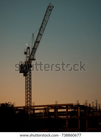 construction site with sunset light, tower crane, Silhouette Construction Crane