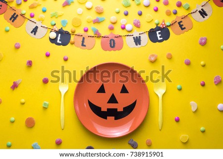 top view halloween horror party holiday season greeting with set prop on background, pumpkin colorful, dinner, spoon and fork with dish, sweet candy kids, banner paper, trick or treat
