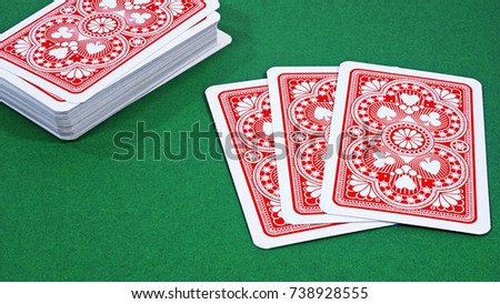 A playing cards on a green table