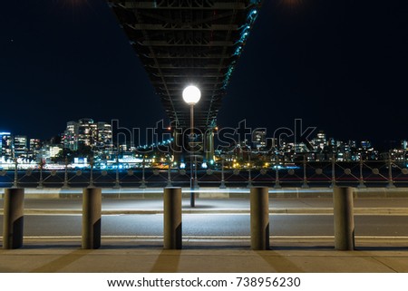 Lamp and street under the bridge at night.