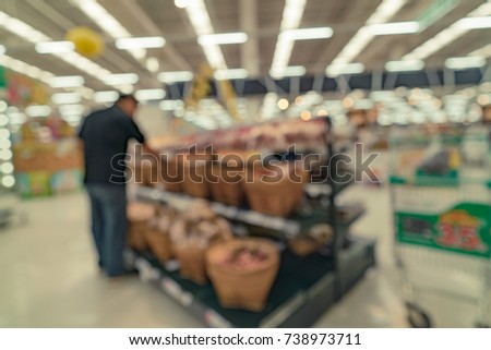 Abstract blurred image of people in supermarket for background usage